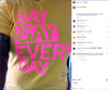 A person wearing a supportive LGBTQ+ pride t-shirt featuring the phrase SAY GAY EVERY DAY in bold, bright pink capital letters.