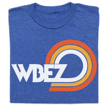 Blue crew neck t-shirt featuring an official WBEZ Chicago logo followed by orange and yellow concentric semicircles.