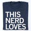 An officially licensed navy blue Raygun t-shirt with the text THIS NERD LOVES printed in large white capital letters.