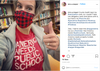 A woman wearing a red and black buffalo plaid face mask and a union made t-shirt that reads America needs public schools gives a thumbs-up in a library.