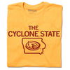 Orange union made T-shirt with the text THE CYCLONE STATE above an outline of Iowa containing a cardinal bird logo.