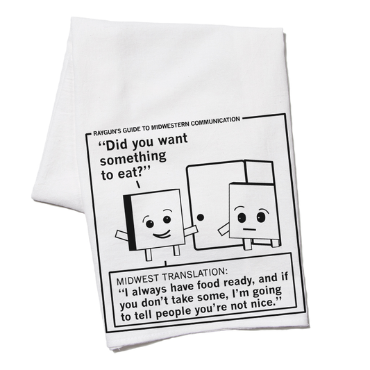 A RAYGUN flour sack kitchen towel printed with a cartoon titled Rayguns Guide to Midwestern Communication, showing two boxes near a door with the phrase Did you want something to eat? and a Midwest translation about offering food.
