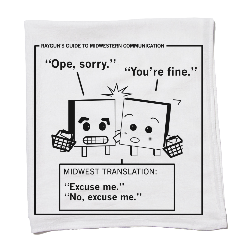 White RAYGUN kitchen towel featuring a cartoon graphic titled Rayguns Guide to Midwestern Communication, depicting two characters bumping into each other with the text Ope, sorry and Youre fine, and a Midwest translation box reading Excuse me.