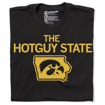 Black RAYGUN t-shirt featuring the text THE HOTGUY STATE in gold above a gold outline of Iowa containing a hawk logo.