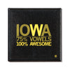 A black square Iowa magnet with yellow text that reads IOWA, 75% VOWELS, 100% AWESOME.