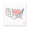 Outlined map of the United States with a red, dotted heart shape over the Midwest, designed as a metal magnet.
