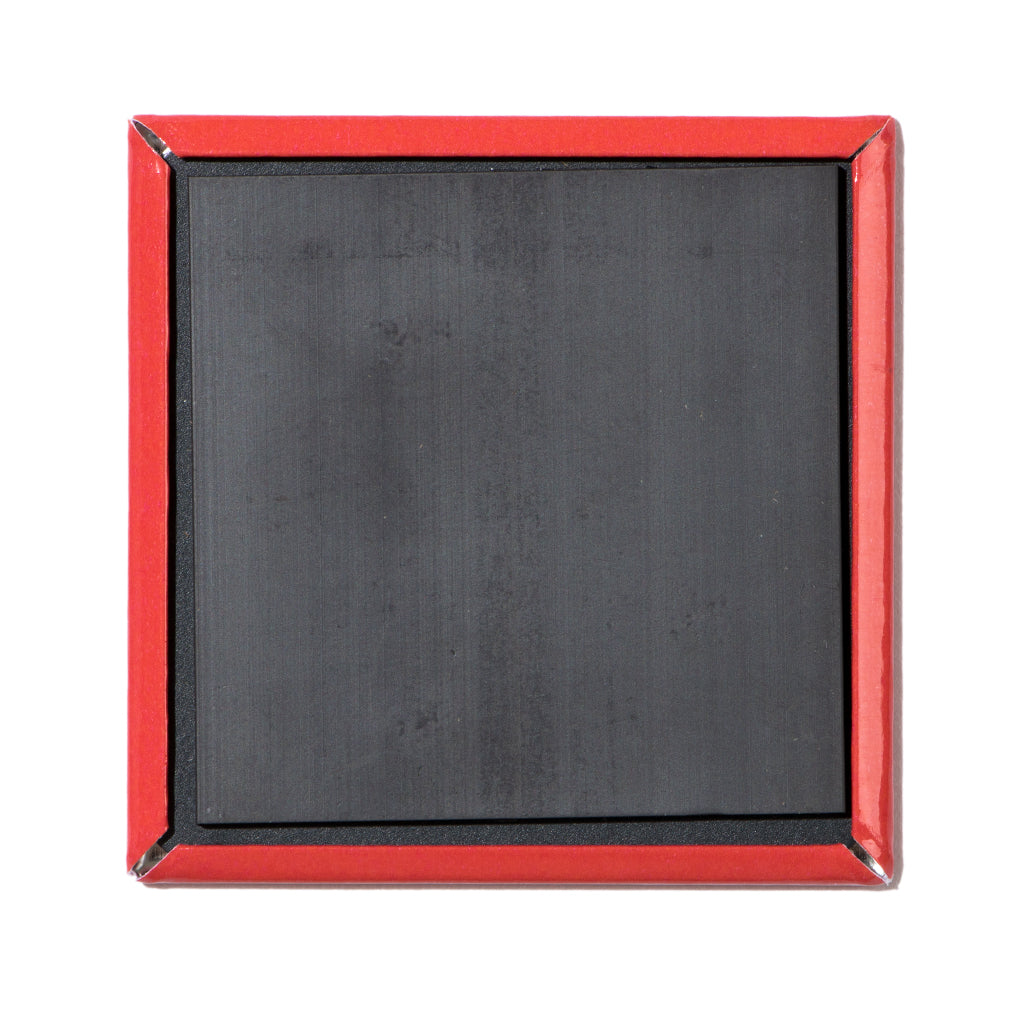 The back of a square, made in USA pinback button featuring a black magnetic surface.