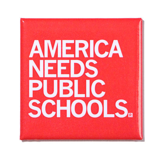 Square red metal magnet pin reading AMERICA NEEDS PUBLIC SCHOOLS in bold white text.