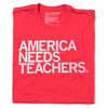 A red union made t-shirt featuring the text AMERICA NEEDS TEACHERS. printed in white on the front.