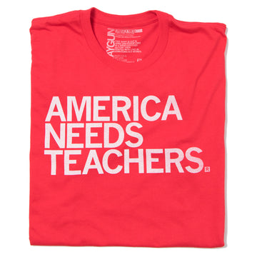 A red union made t-shirt featuring the text AMERICA NEEDS TEACHERS. printed in white on the front.