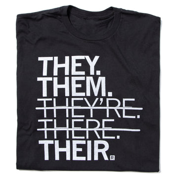Black union made t-shirt with white text reading THEY. THEM. THEYRE. THERE. THEIR., featuring strikethroughs over THEYRE and THERE.