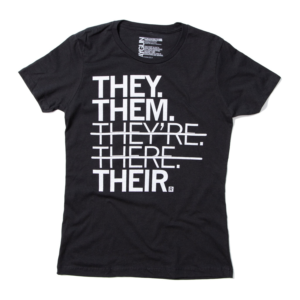 Black union-made t-shirt featuring the text THEY. THEM. THEYRE. THERE. THEIR. with strike-through lines across the middle three words to highlight gender pronouns.