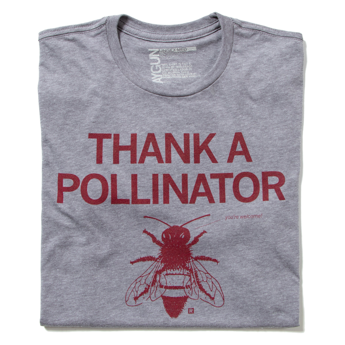 Gray heathered union-made t-shirt printed with the text THANK A POLLINATOR, the words you’re welcome!, and an illustration of a bee.