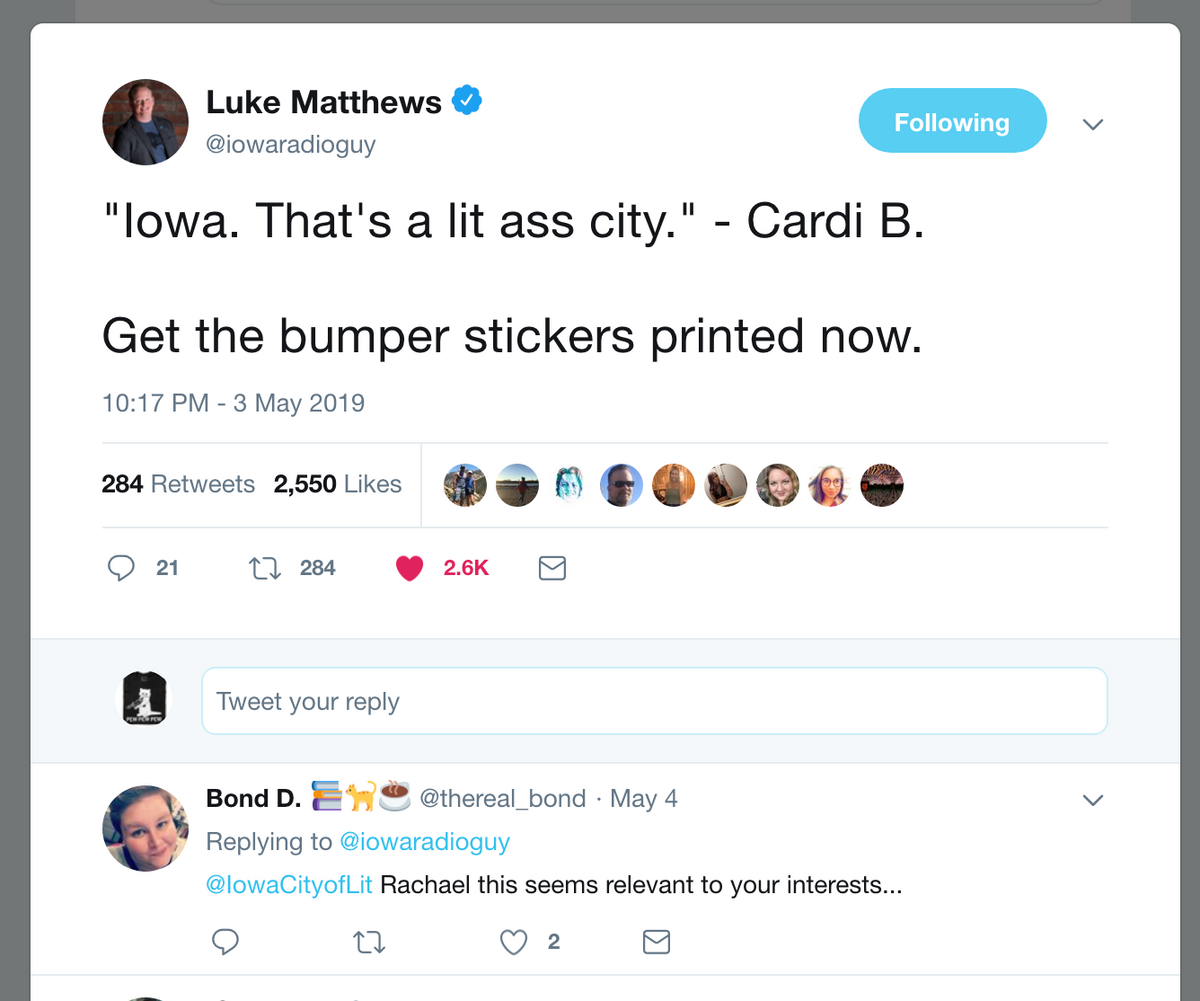 A Twitter thread showing a tweet from Luke Matthews quoting Cardi B saying Iowa is a lit ass city, followed by a reply from Bond D. tagging @IowaCityofLit, which features a retired design of an Iowa t-shirt.