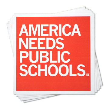 A stack of square vinyl stickers featuring the white text AMERICA NEEDS PUBLIC SCHOOLS on a red background.
