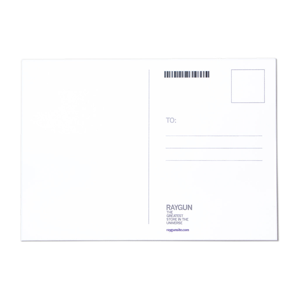 The back of a RAYGUN postcard featuring a stamp box, address lines, and branding for the store, proudly Made in USA.