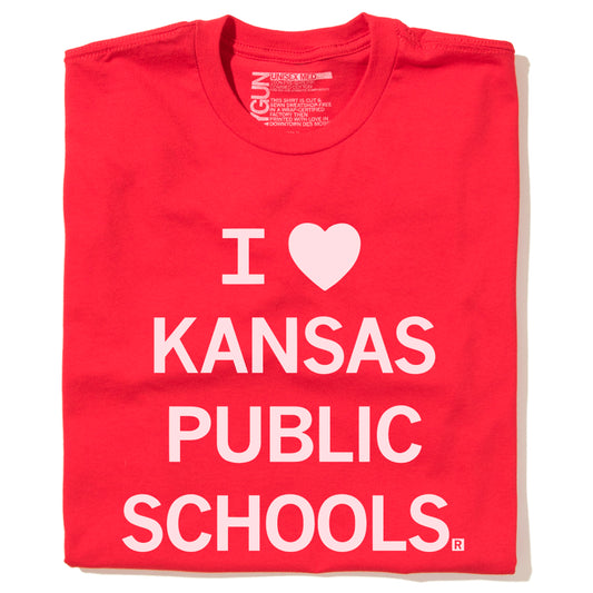 Red RAYGUN t-shirt with the text I heart Kansas Public Schools printed in white.