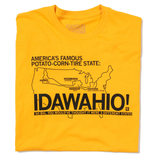 Gold t-shirt featuring a map of the United States with the text AMERICAS FAMOUS POTATO-CORN-TIRE STATE: IDAWAHIO! SO BIG, YOU WOULDVE THOUGHT IT WERE 3 DIFFERENT STATES.