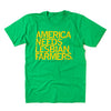 Kelly green shirt with gold ink that says, "America Needs Lesbian Farmers" in all caps.