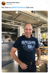 A smiling man wears a navy blue RAYGUN Midwest T-shirt featuring a map of the United States with the region highlighted and the text THE MIDWEST: OPE, THERE IT IS!.