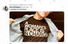 A person wearing a sweatshop-free t-shirt that says A woman’s place is in charge underneath an open button-down shirt.