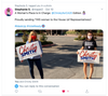 Two women standing outdoors in union-made clothing, each holding a sign that reads Christy Smith for U.S. Congress.