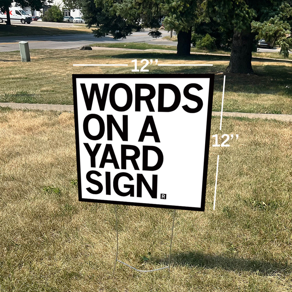 Words on a yard sign outdoors garden